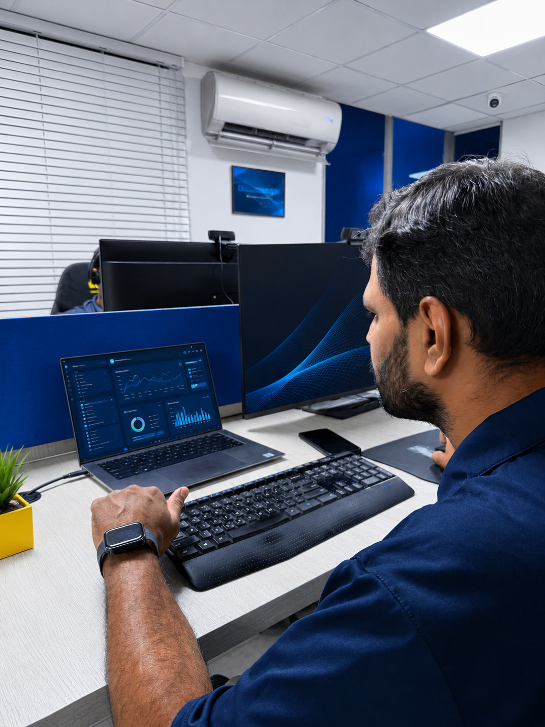Professionals reviewing work on a laptop